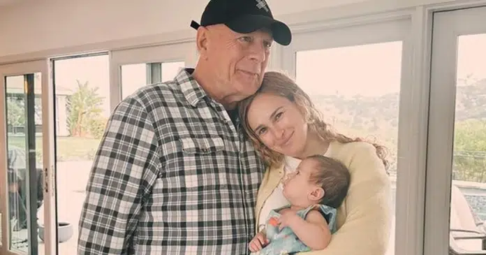 Após diagnóstico de demência, Bruce Willis aparece em foto rara carregando o neto